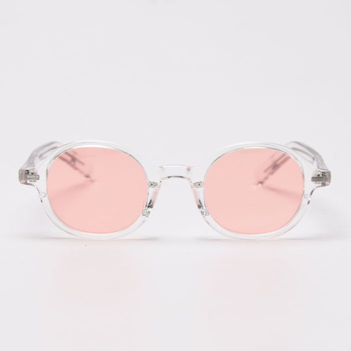 Sunglasses with pink lenses and clear frame on a white background