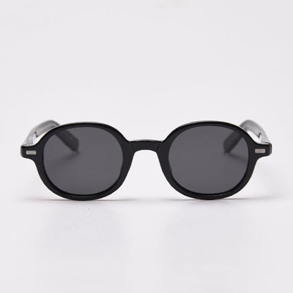 Round sunglasses with black frame and dark lenses on a white background